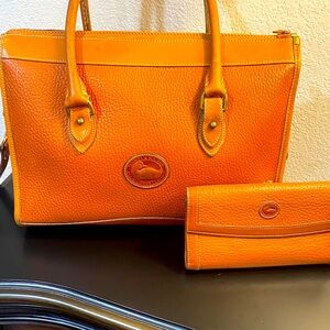 Vintage Dooney & Bourke All-weather Leather shoulder bag and matching wallet.